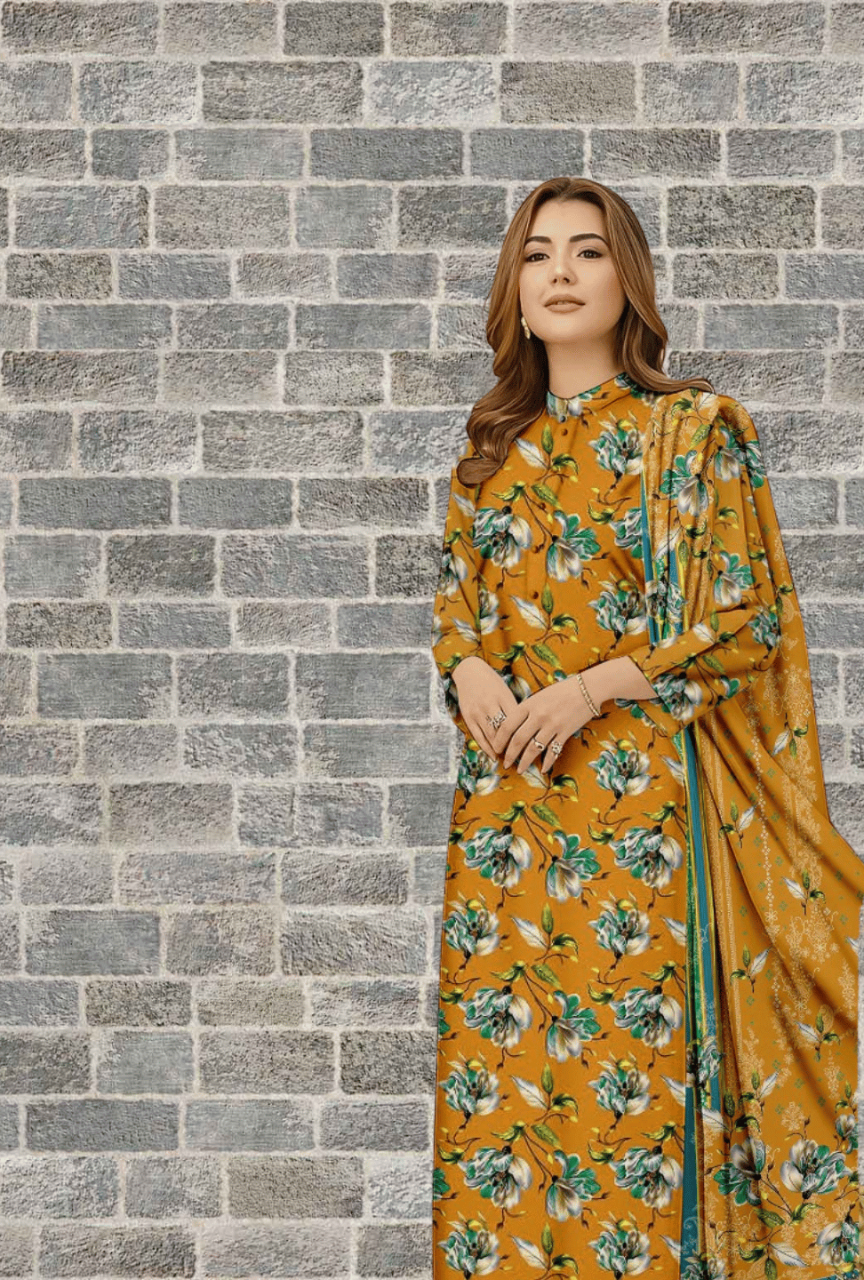 Woman in a floral dress standing against a brick wall