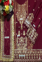 Maroon and gold embroidered fabric with labels indicating parts of the garment.