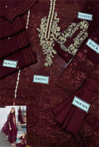 Maroon embroidered outfit with labels indicating parts of the garment.