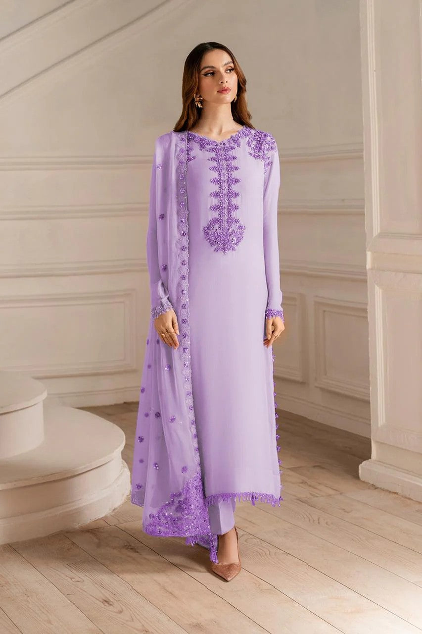 Woman wearing a lavender embroidered outfit in a classical setting