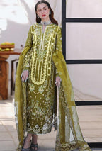 Woman wearing a green embroidered traditional outfit with a sheer dupatta.