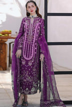 Woman wearing a purple embroidered outfit with a white background