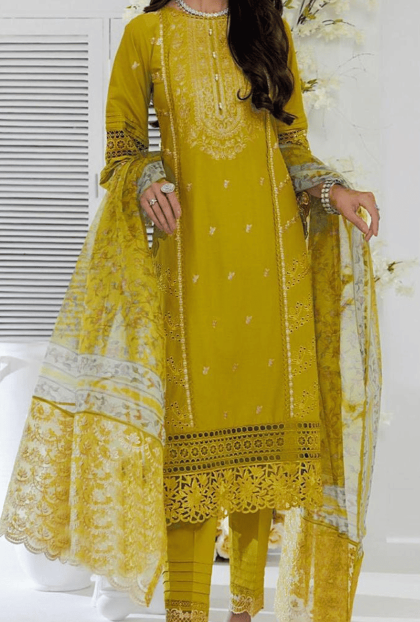 Yellow embroidered traditional outfit with a white background