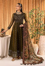 Woman in a black and gold traditional outfit with a floral dupatta against a decorative backdrop.