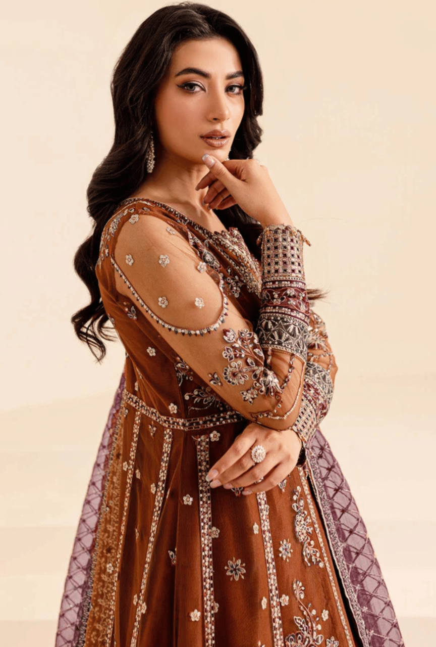Woman wearing an embroidered traditional outfit with a beige background