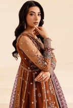 Woman wearing an embroidered traditional outfit with a beige background
