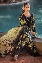 Woman in a floral outfit sitting by a pool