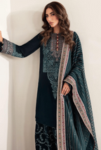 Woman wearing a traditional outfit with intricate patterns on a plain background