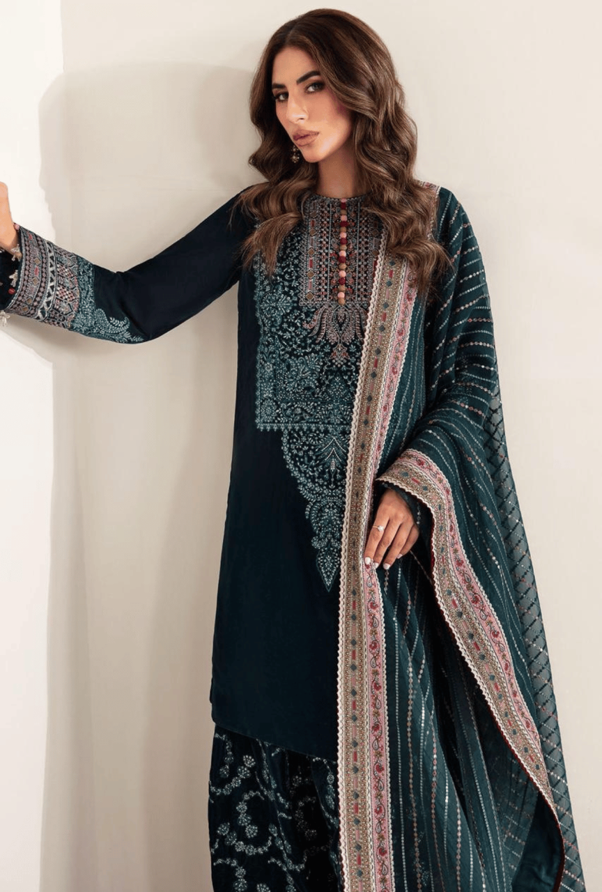 Woman wearing a traditional outfit with intricate patterns on a plain background