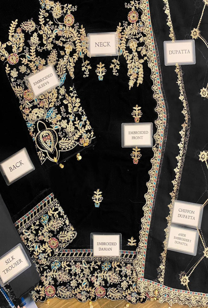 Embroidered fabric with jewelry labels on a black background