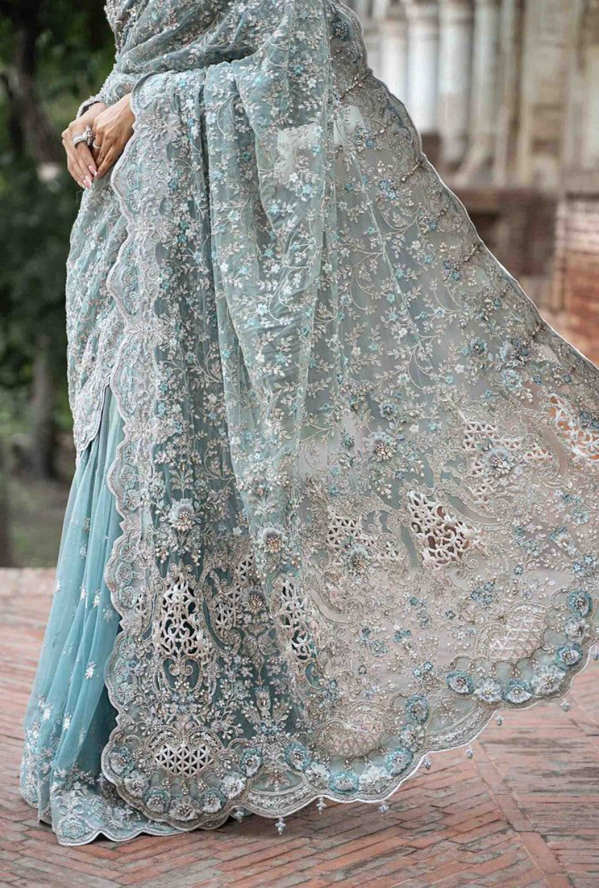 Decorative saree with intricate patterns on a textured surface