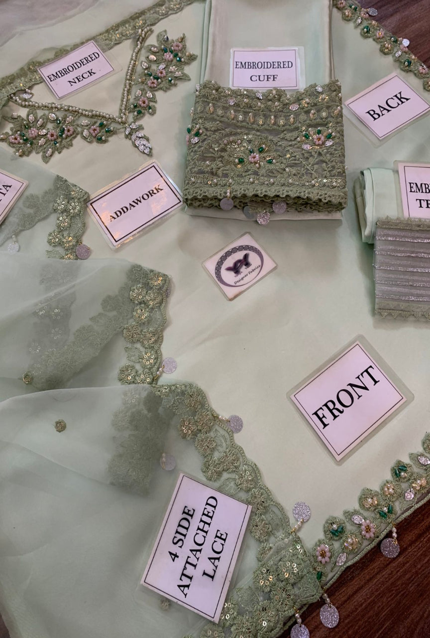 Embroidered fabric with labels on a table