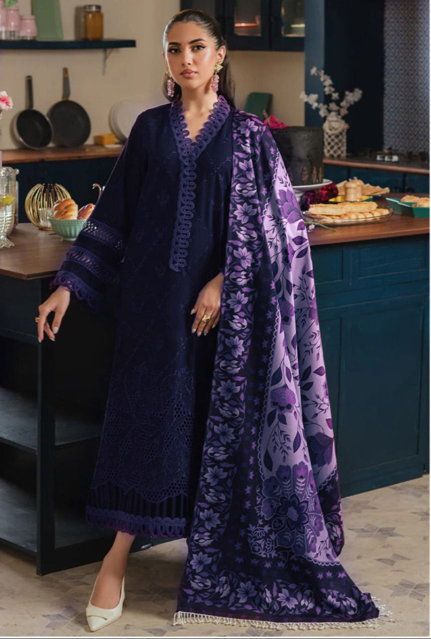 Woman in a dark blue dress with a matching shawl in a kitchen setting