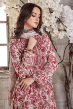 Woman wearing a red and white floral patterned dress with a neutral background