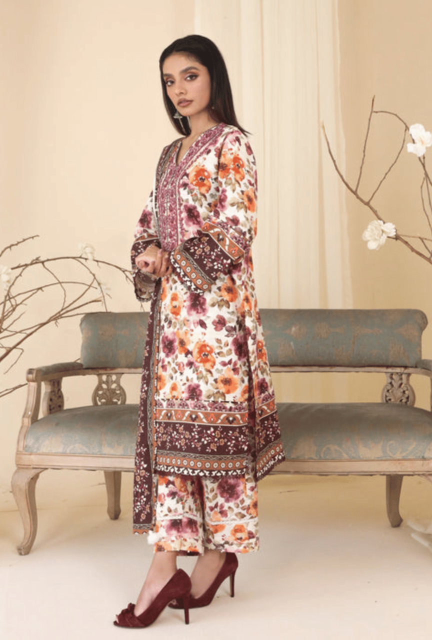 Woman wearing a floral dress with a patterned background