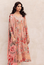 Woman wearing a floral dress with a plain background