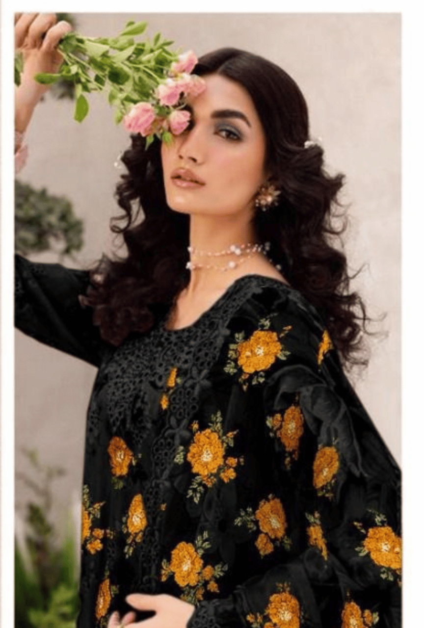 Woman wearing a black floral dress with a blurred background