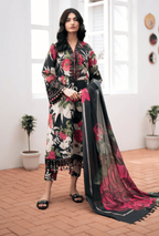 Woman in a floral outfit with a matching shawl in a bright room.